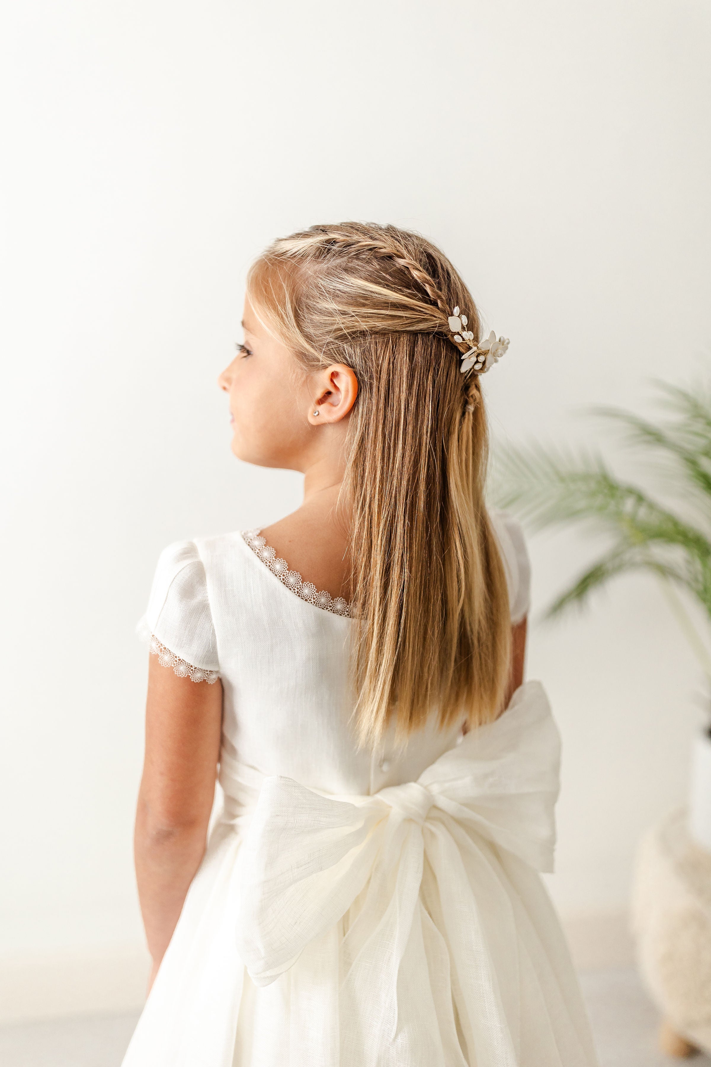 Couture-level detailing on Couture T047 First Communion dress with polished finish