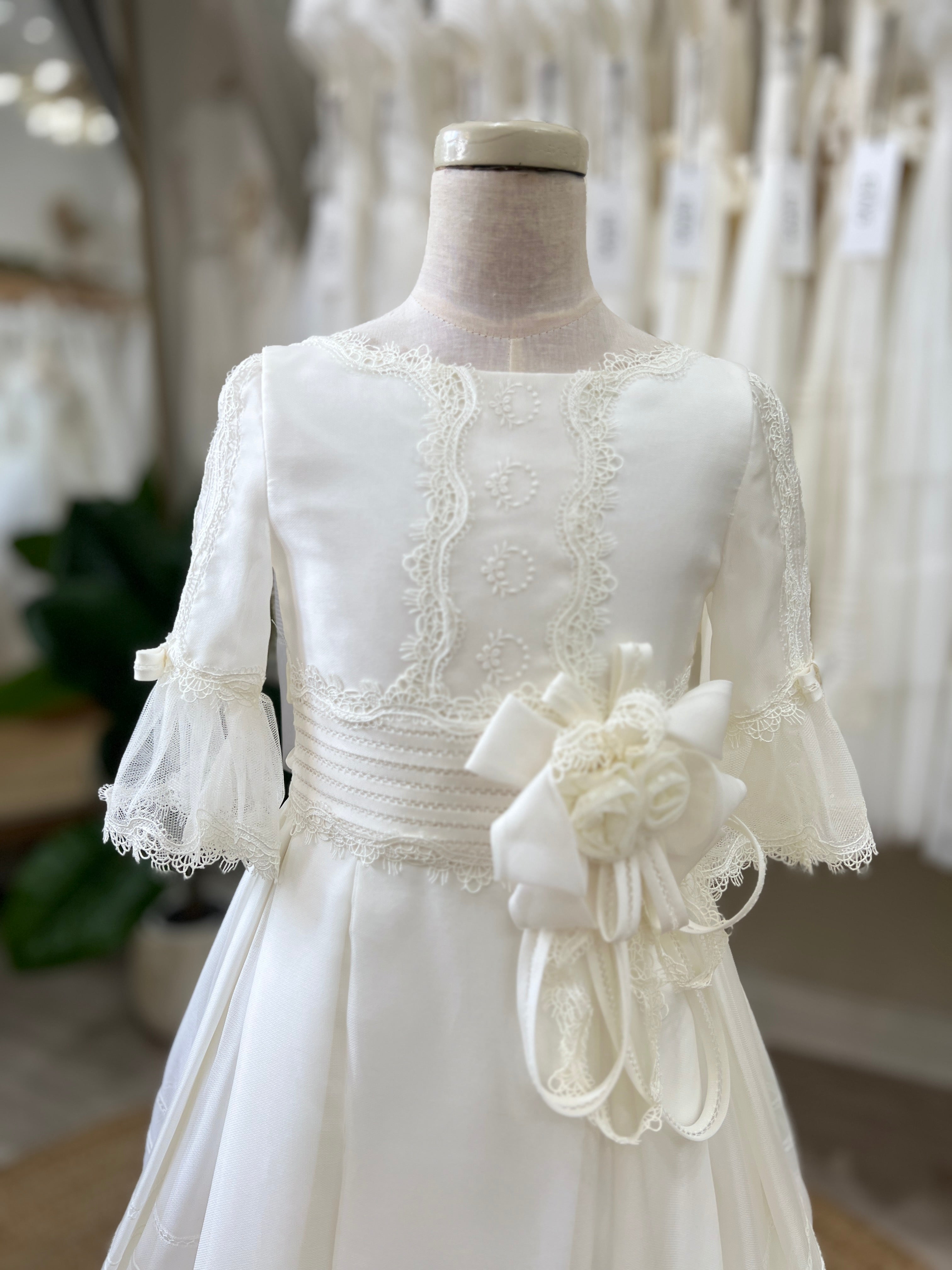 Traditional S126 First Communion dress with elegant lace trim and classic finish