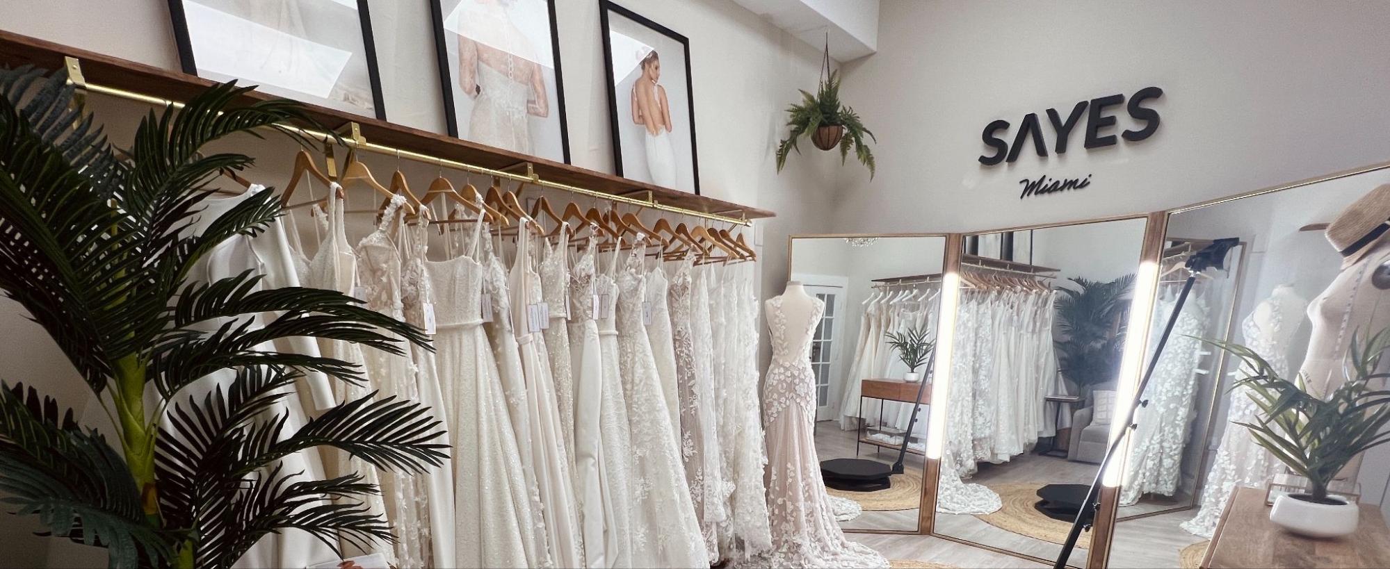 Bride trying on a modern wedding dress at SAYES Miami bridal boutique in Coral Gables