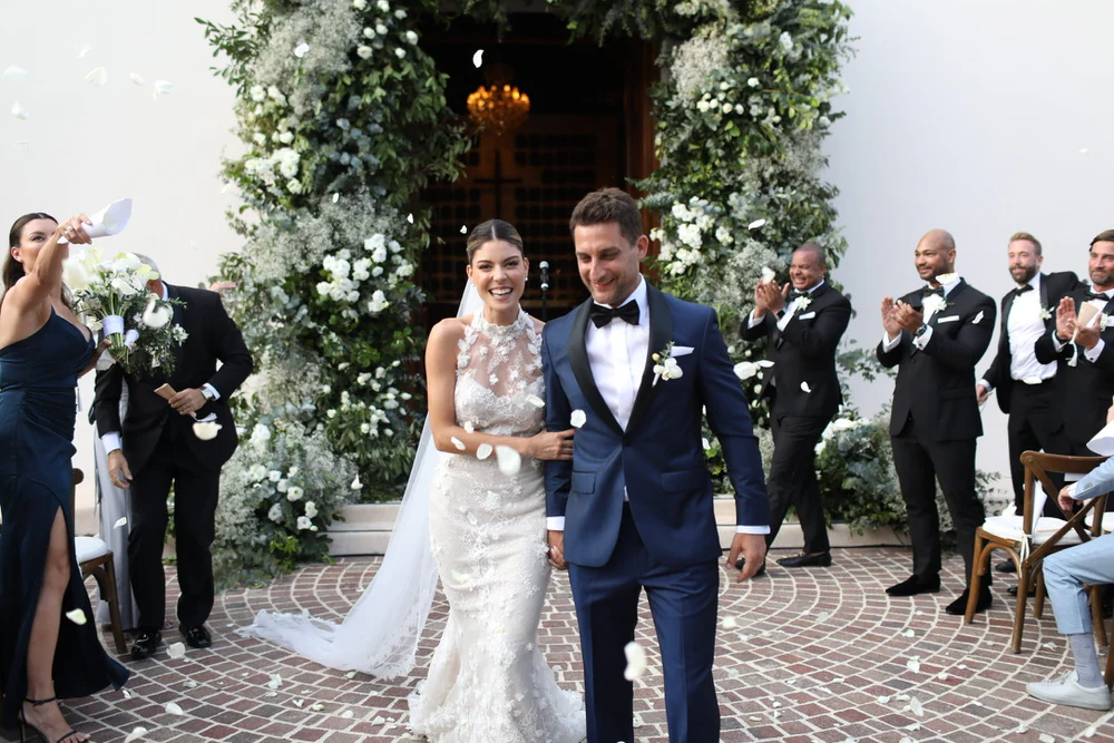 Bride in a romantic garden wedding setting wearing an elegant bridal look